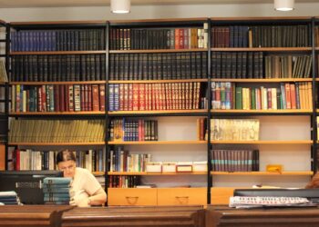 Woman reading in a library