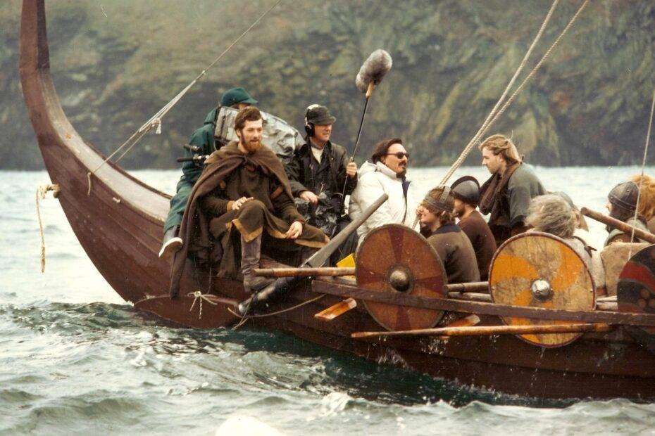 Director Leo Eaton and his camera crew filming aboard a recreated Viking longship off Peel in the Isle of Man in a scene from the VIKINGS episode of Timeline
