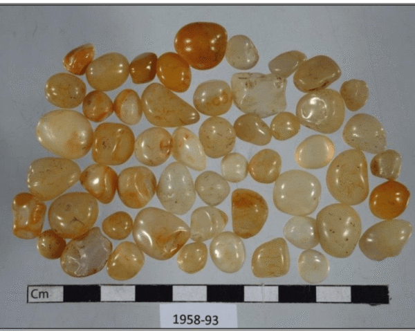 A collection of yellow and white quartz stones from an Icelandic pagan grave